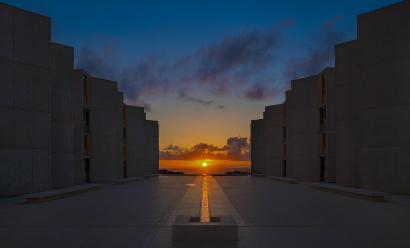 The setting sun lines up with the “River of Life” at the Salk Institute.