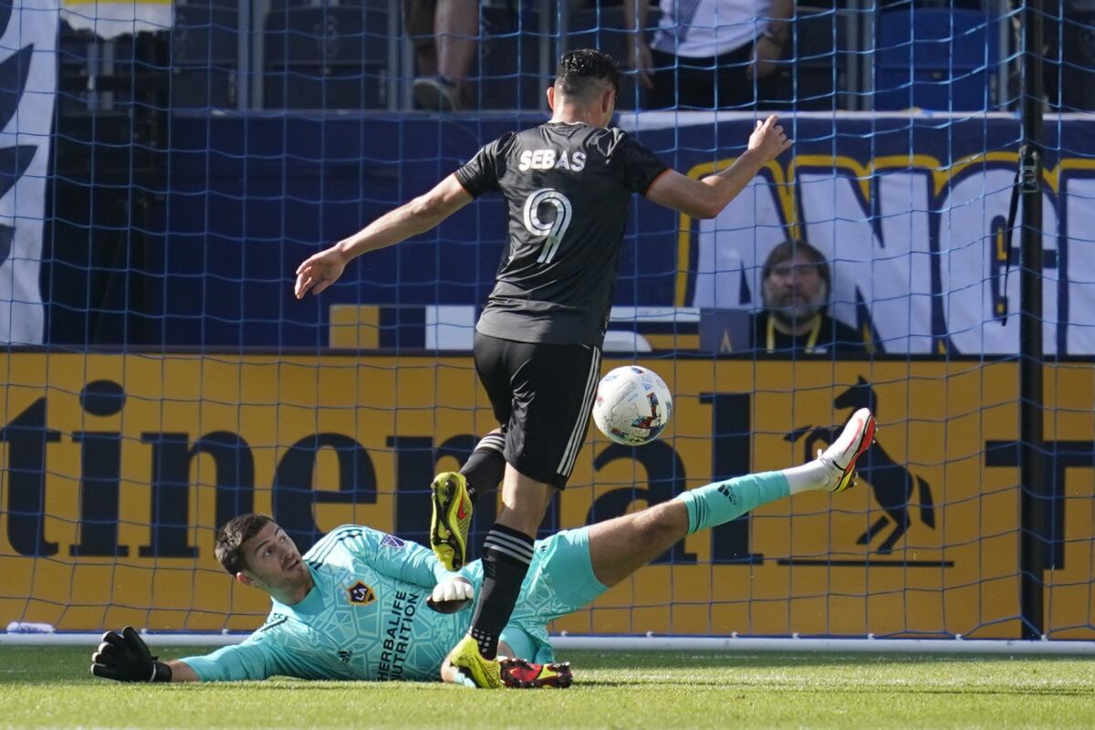 Houston Dynamo forward Sebastián Ferreira scores against the Galaxy in the first half.