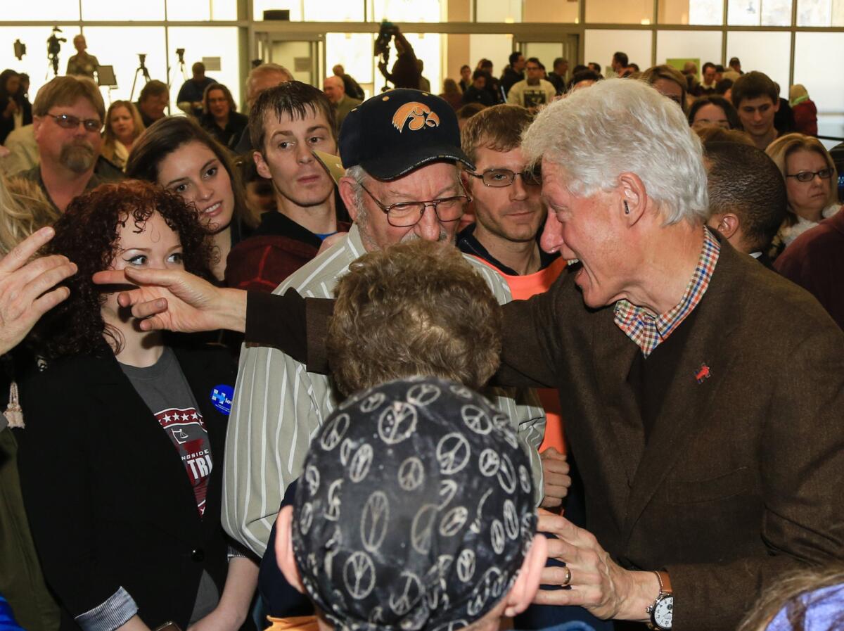 Former President Clinton meets with audience members after speaking at a campaign event for his wife, Democratic presidential candidate Hillary Clinton, on Jan. 15 in Sioux City, Iowa.