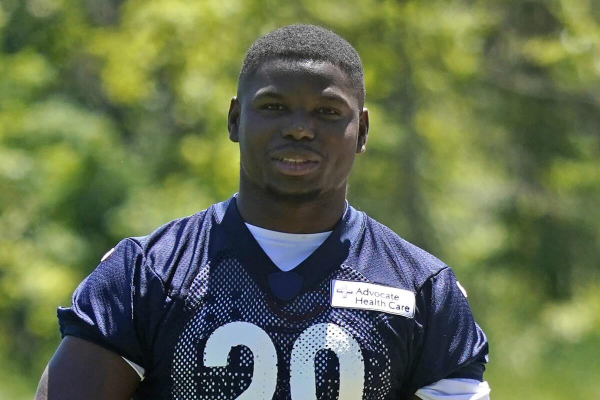 FILE - Chicago Bears running back Tarik Cohen watches teammates during NFL football practice in Lake Forest, Ill., Wednesday, June 16, 2021. Former Chicago Bears running back Tarik Cohen, now a free agent, apparently suffered an injury during a training session being live-streamed on his Instagram account. The hard-luck player, released in March by the Bears due to past injuries, grabbed the back of his leg after going down during the workout. The incident was seen on Instagram Live. (AP Photo/Nam Y. Huh, File)