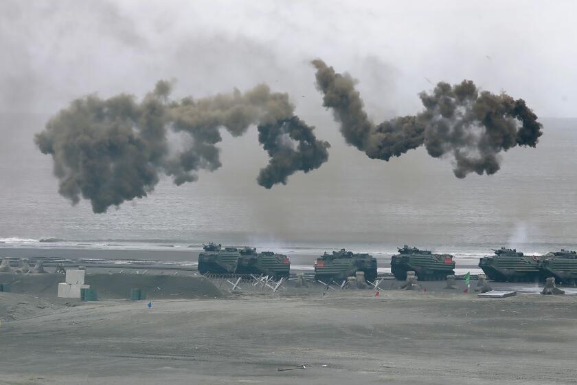 Taiwan's military holds drills of the annual Han Kuang military exercises that simulate an anti-landing operations near the coast in New Taipei City, northern Taiwan, Thursday, July 27, 2023. Taiwan military mobilized for routine defense exercises from July 24-28. (AP Photo/Chiang Ying-ying)