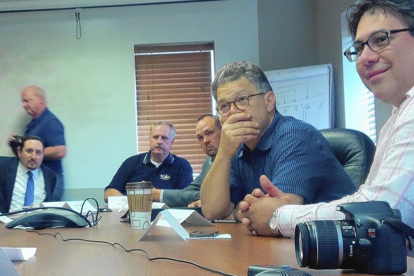 Sen. Al Franken listens during a discussion of worker training programs when he visited manufacturing company Relco in Willmar, Minn., last month.