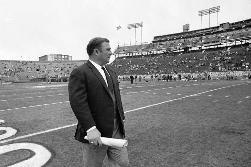 Kansas City Chiefs Coach Hank Stram walks on to field at Tulane Stadium prior to the start of Super Bowl IV in 1970.