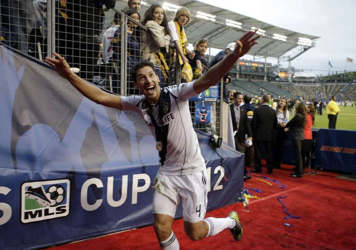 Galaxy defender Omar Gonzalez reacts to fans during a game.