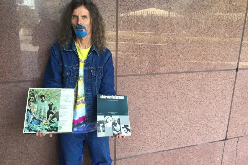 Blue Boy, 65, shows his copy of Spirit's 1968 debut album in his right hand, and the sheet music for Led Zeppelin's "Stairway to Heaven" in his left. He has attended every day of the Zeppelin-Spirit copyright infringement trial underway in Los Angeles.