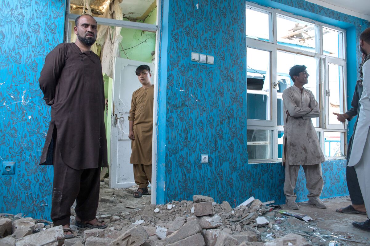 Sakhi Murad Sadar, 28, stands in what is left of his house, hit by a car bomb on Sept. 2, 2019, that targeted an international residential and office compound in Kabul, Afghanistan. He says he won't be voting during this year's election.