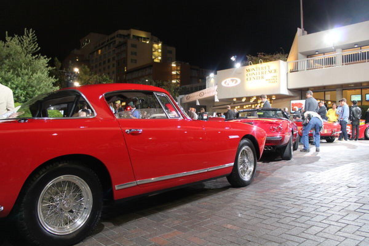 A trio of rare Ferraris await their turn on the auction block at RM Auctions' sale in Monterey. Five auction companies selling cars during Monterey Car Week sold more than $300 million worth of cars.