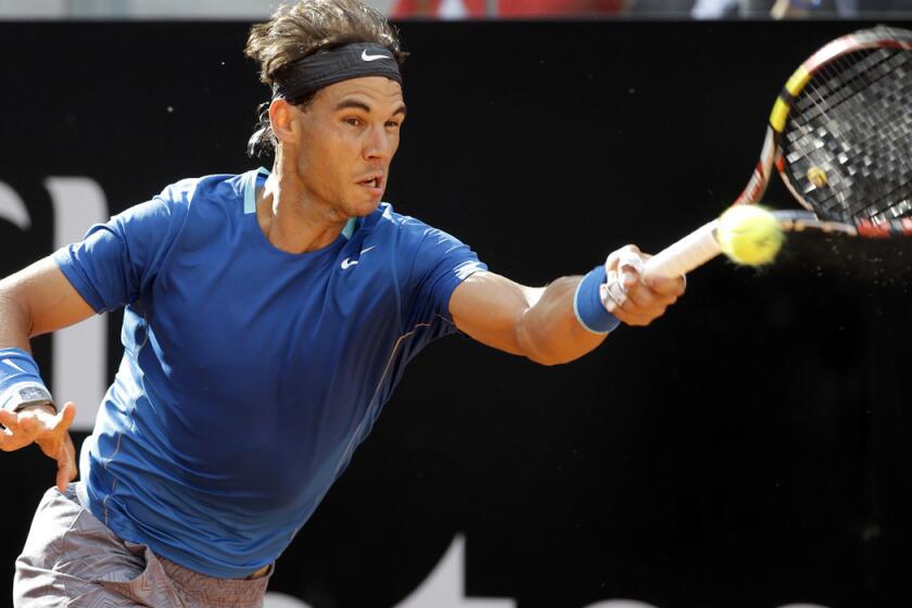 Rafael Nadal tracks down a shot in a victory over Mikhail Youzhny on Thursday at the Italian Open in Rome.