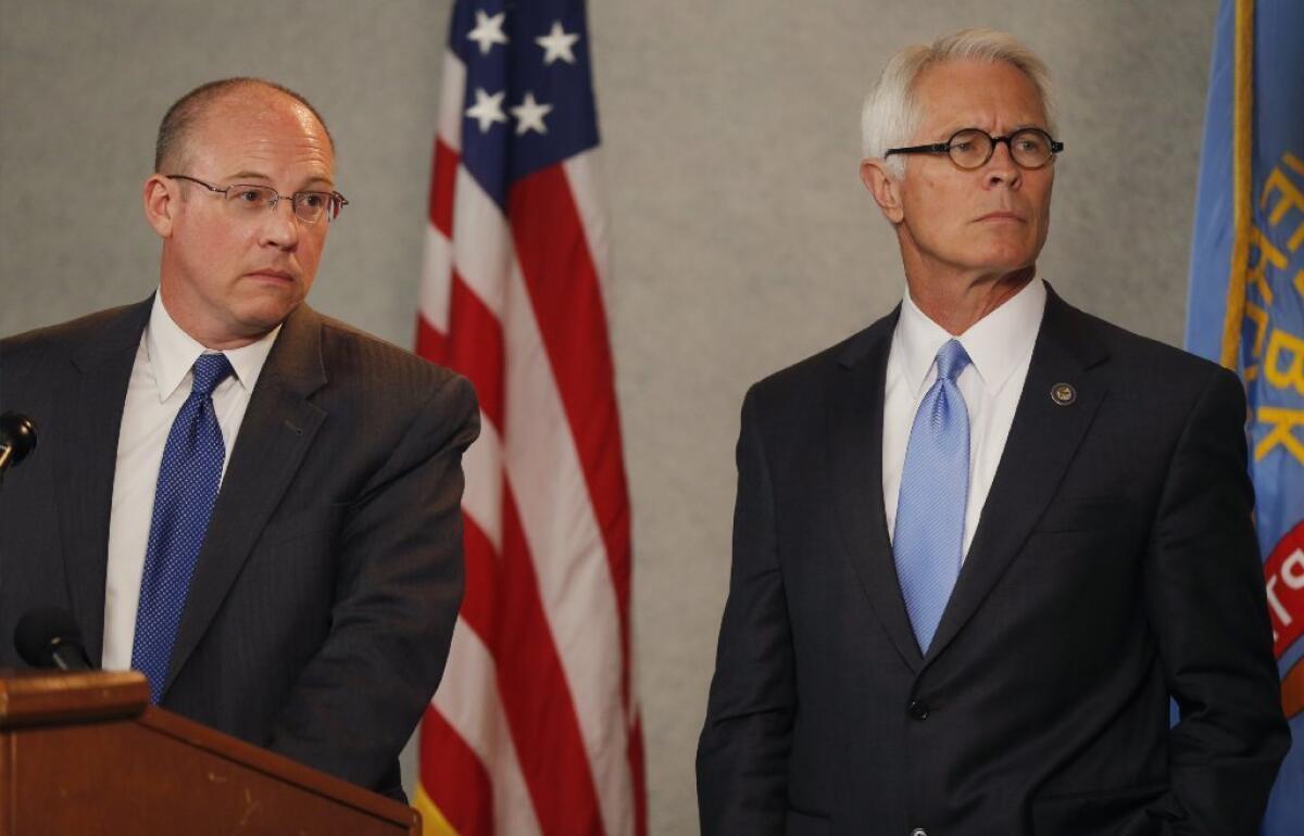Johnson County, Kansas, Dist. Atty. Steve Howe, left, and U.S. Attorney Barry Grissom at a news conference Tuesday about the killings in Overland Park on Sunday.