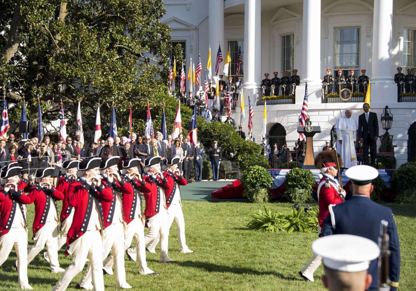 President Barack Obama and Pope Francis review the Fife and Drum Corps during an arrival ceremony on the South Lawn of the White House on Sept. 23, 2015.