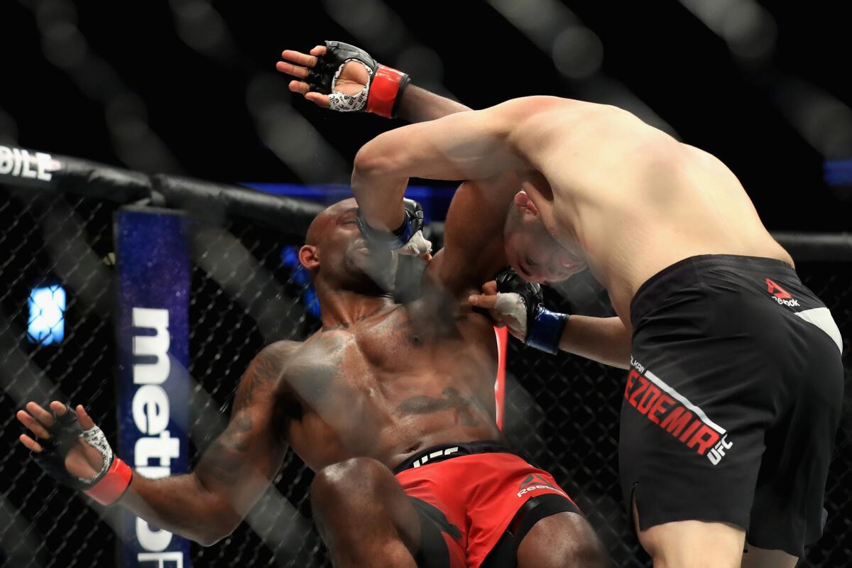 Volkan Oezdemir takes down Jimmy Manua during their light-heavyweight bout at UFC 214.