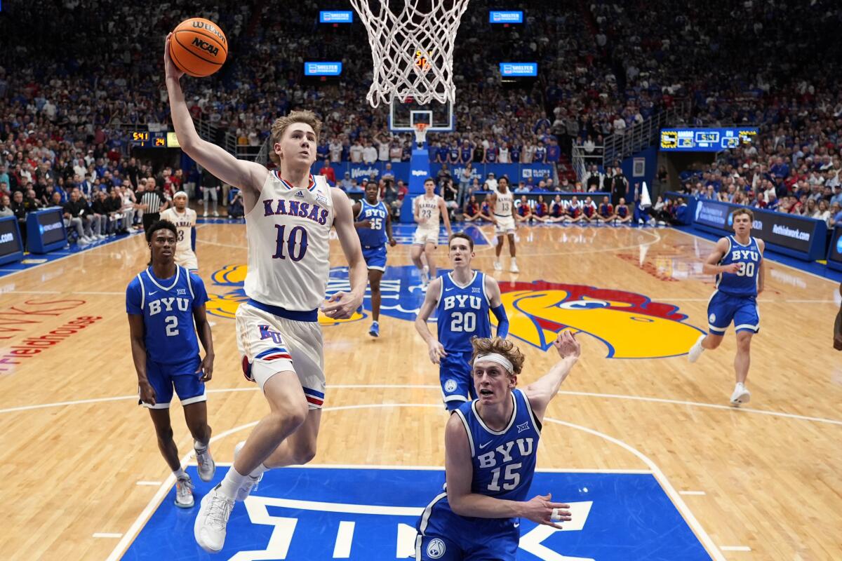 Kansas guard Johnny Furphy (10) dunks the ball during a game against BYU on Feb. 27 in Lawrence, Kan.