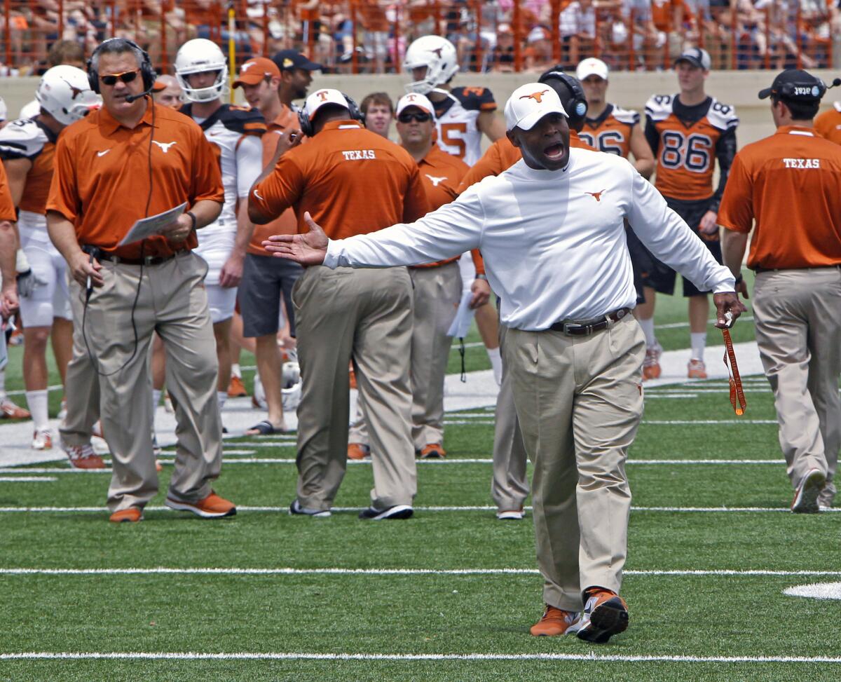 New Texas Coach Charlie Strong calls out to his players during Longhorns' spring football game on April 19.