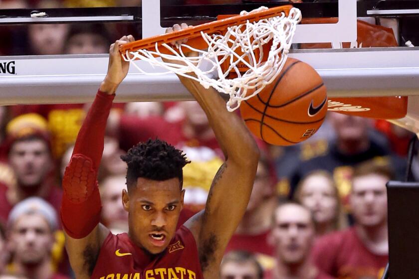 Iowa State's Monte Morris dunks the ball in the second half against Iowa on Thursday.