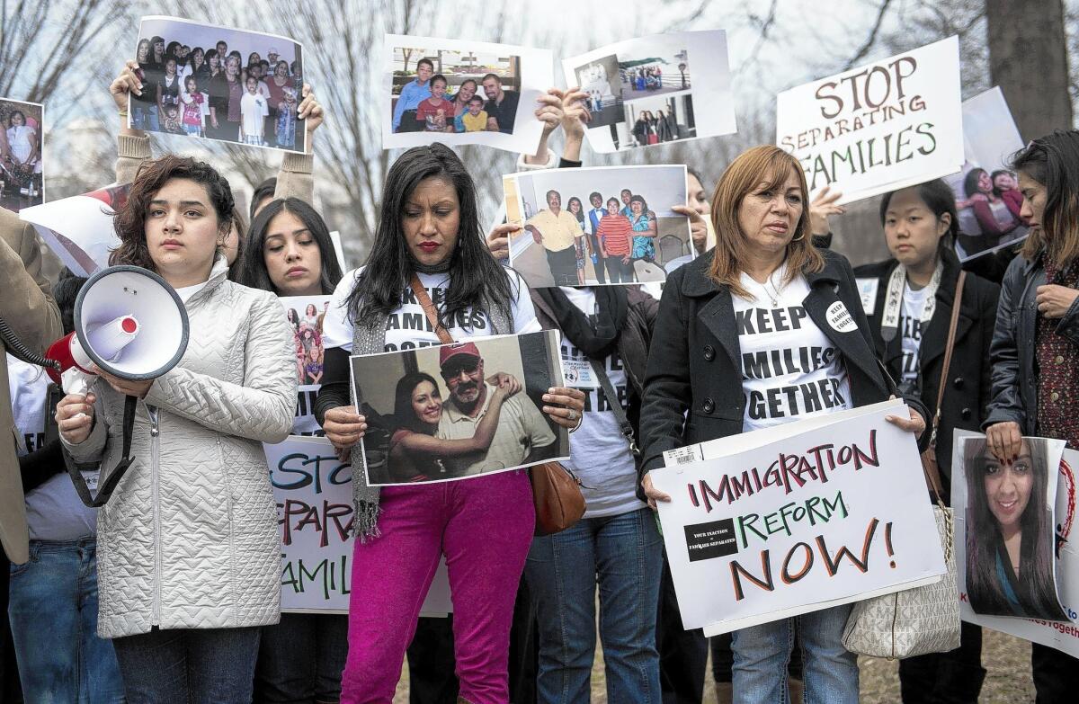 Activists gather outside the White House to protest deportations. President Obama has called on the Department of Homeland Security to enforce immigration laws "more humanely."