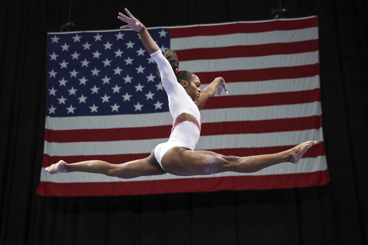 Shilese Jones competes on the beam during the 2022 U.S. Gymnastics Championships on Friday, Aug. 19, 2022, in Tampa, Fla.(AP Photo/Mike Carlson)