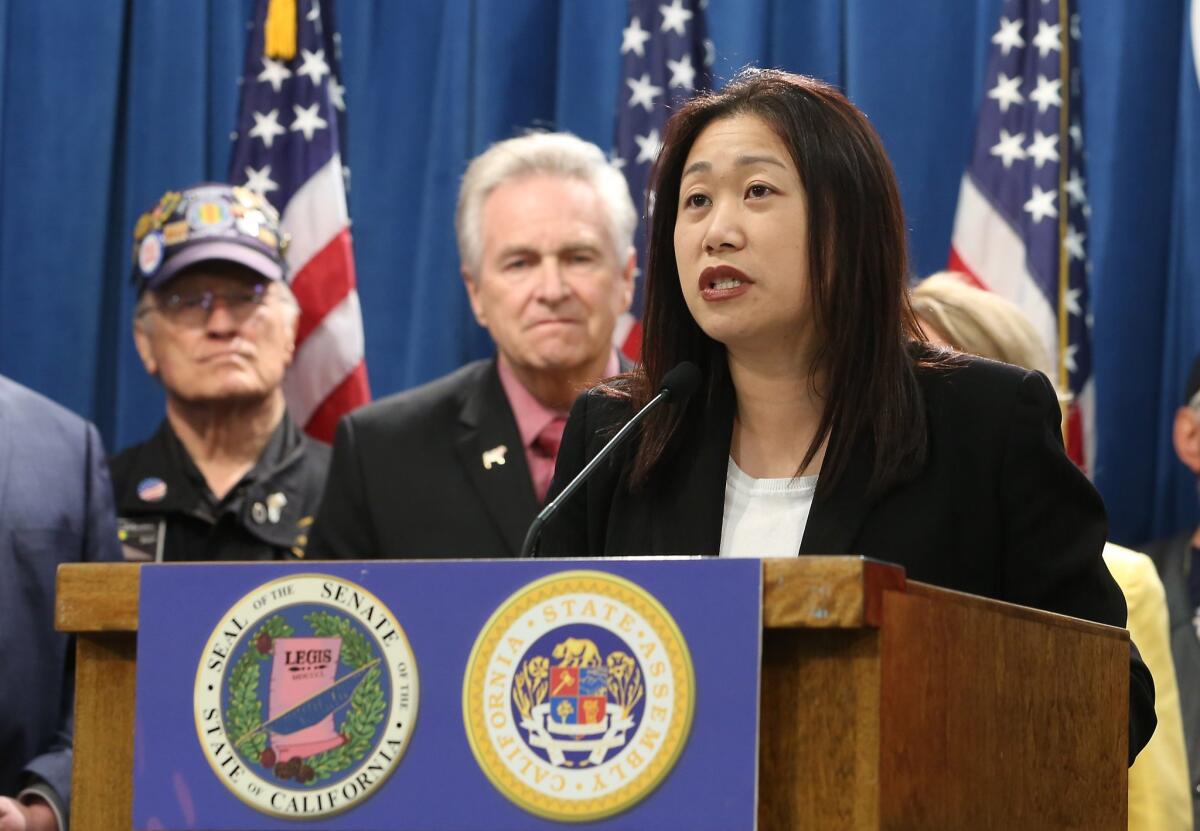 Accompanied by fellow GOP lawmakers and veterans, state Sen. Janet Nguyen (R-Garden Grove) appears at a news conference in Sacramento on Monday to announce a proposed constitutional amendment to block publicly funded universities from banning the American flag.