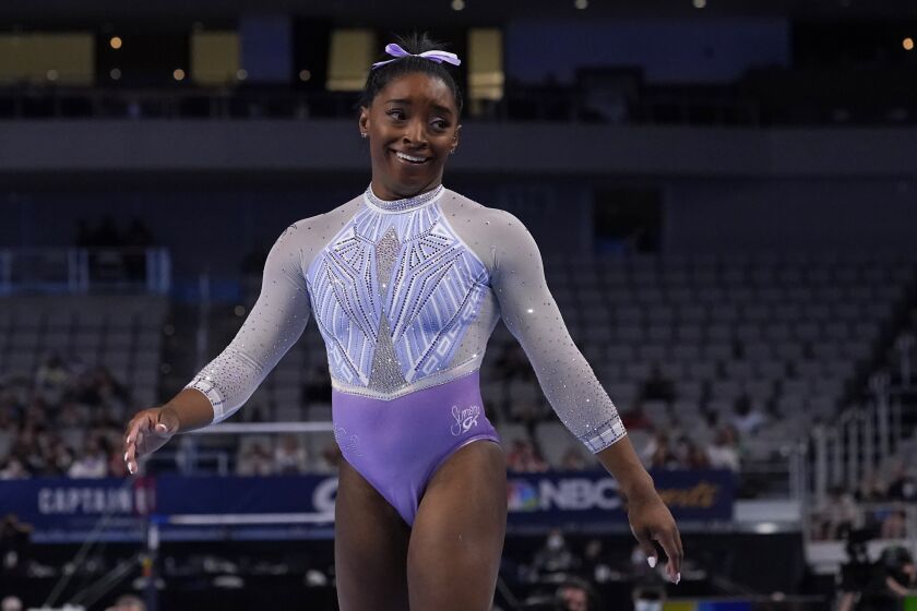 Simone Biles smiles after finishing her floor exercise routine during the U.S. Gymnastics Championships.