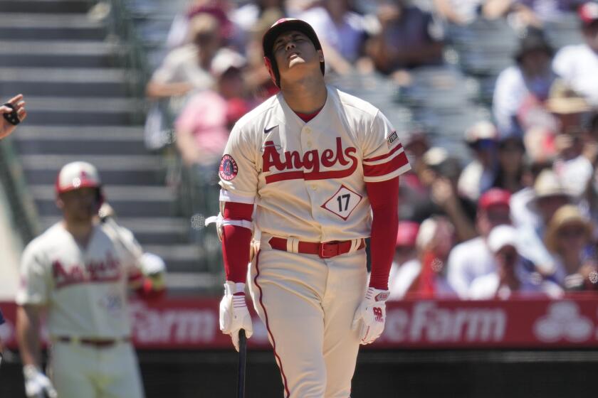 Los Angeles Angels designated hitter Shohei Ohtani (17) reacts after hitting a foul ball.