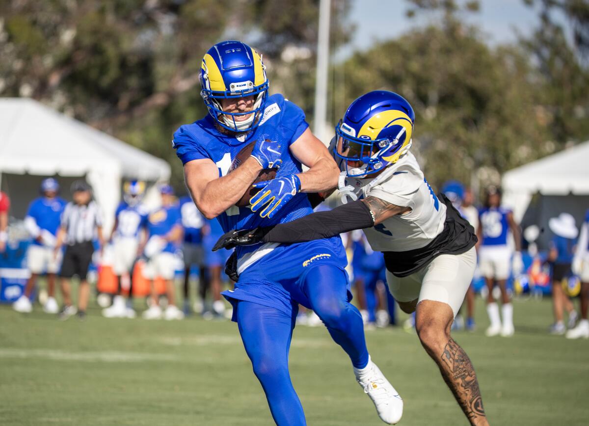 Rams wide receiver Cooper Kupp hauls in a pass during Rams training camp.