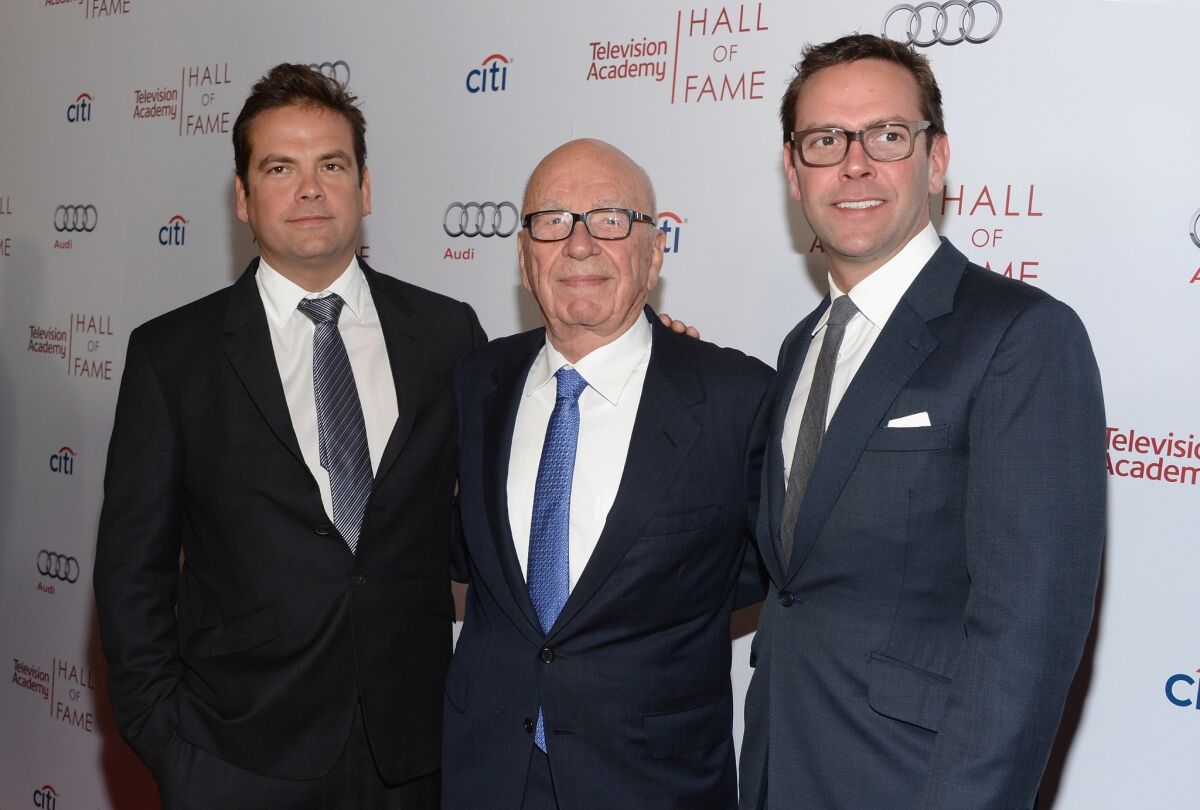 Lachlan Murdoch, left, Rupert Murdoch and James Murdoch attend an event in Beverly Hills earlier this year. For the first time in at least a decade Lachlan and James were seated at the adults' table at 21st Century Fox's annual shareholders meeting on Nov. 12.