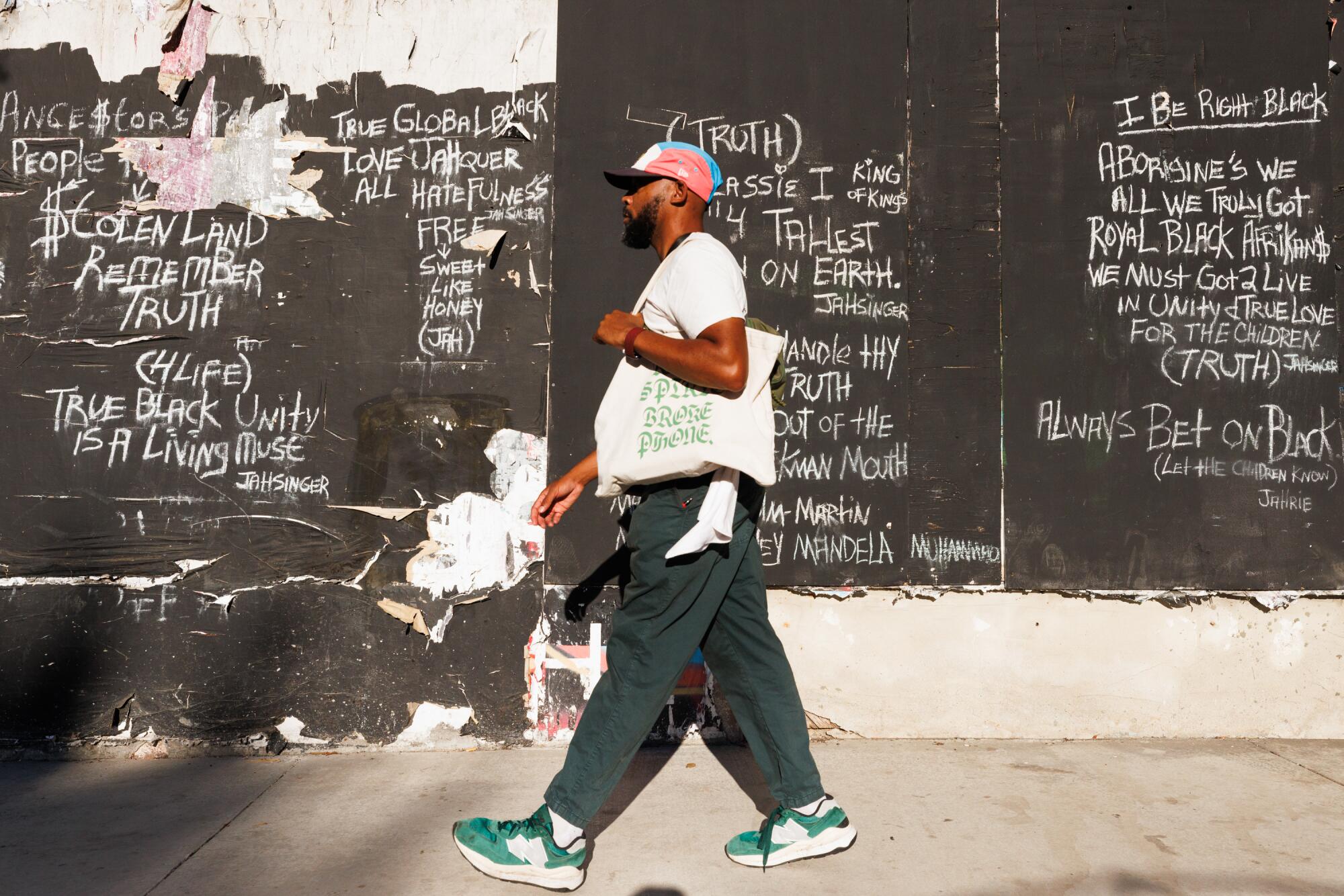 Kevito Clark walks through the streets of Leimert Park.