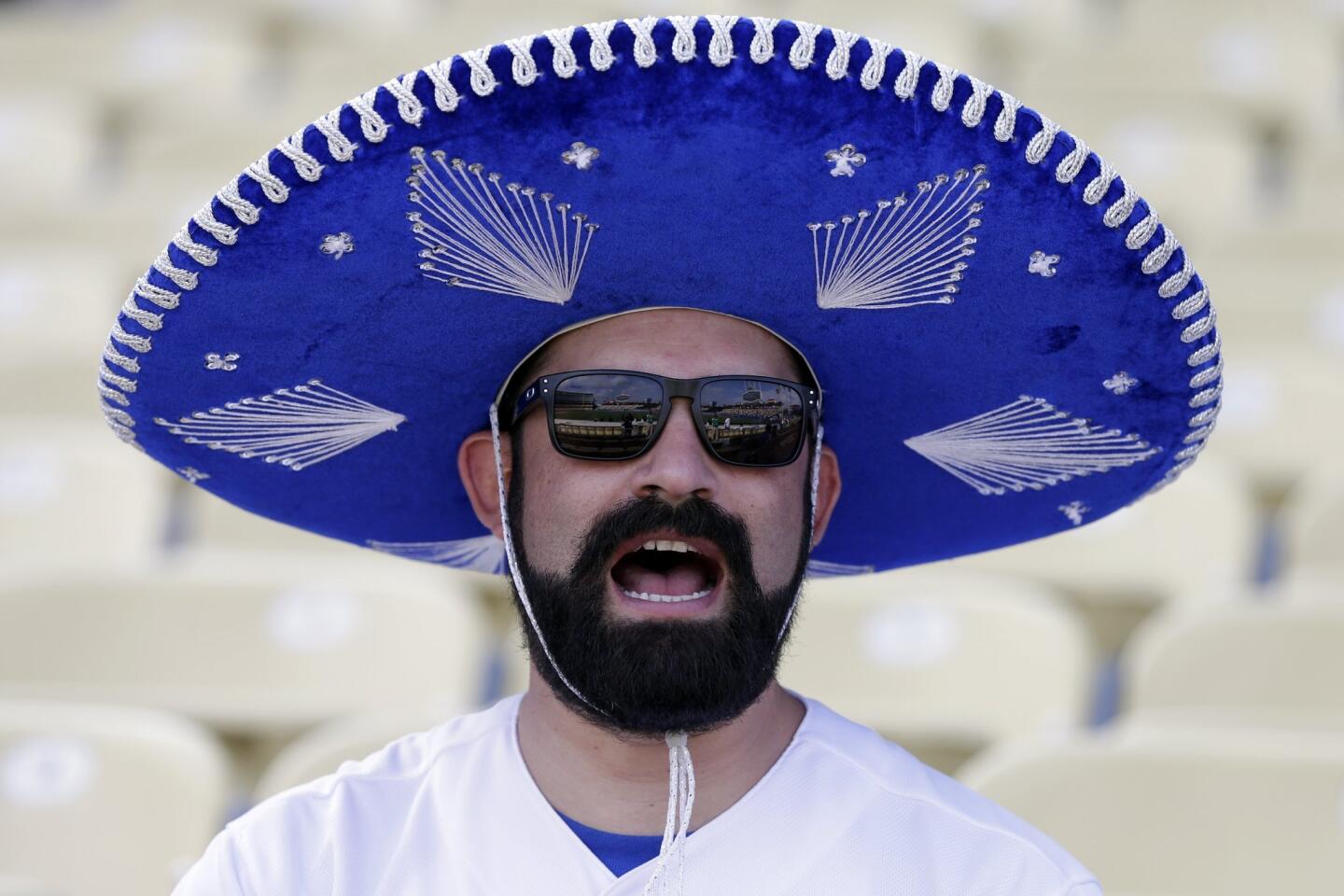 Eric Garda wears a Mexican mariachi hat during batting practice before the Los Angeles Dodgers play the New York Mets in Game 5 of baseball's National League Division Series Thursday, Oct. 15, 2015, in Los Angeles. (AP Photo/Alex Gallardo)