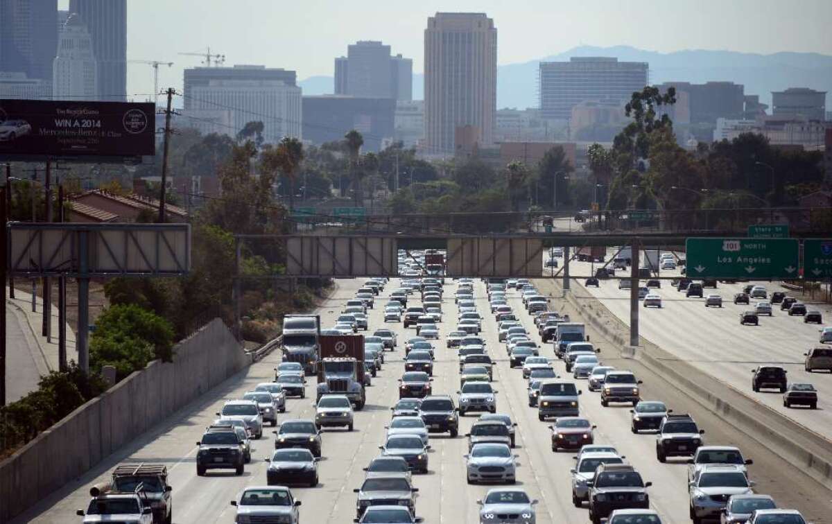 (FILES) This August 30, 2013 file photo shows motorists as they make their way out of downtown Los Angeles, California.