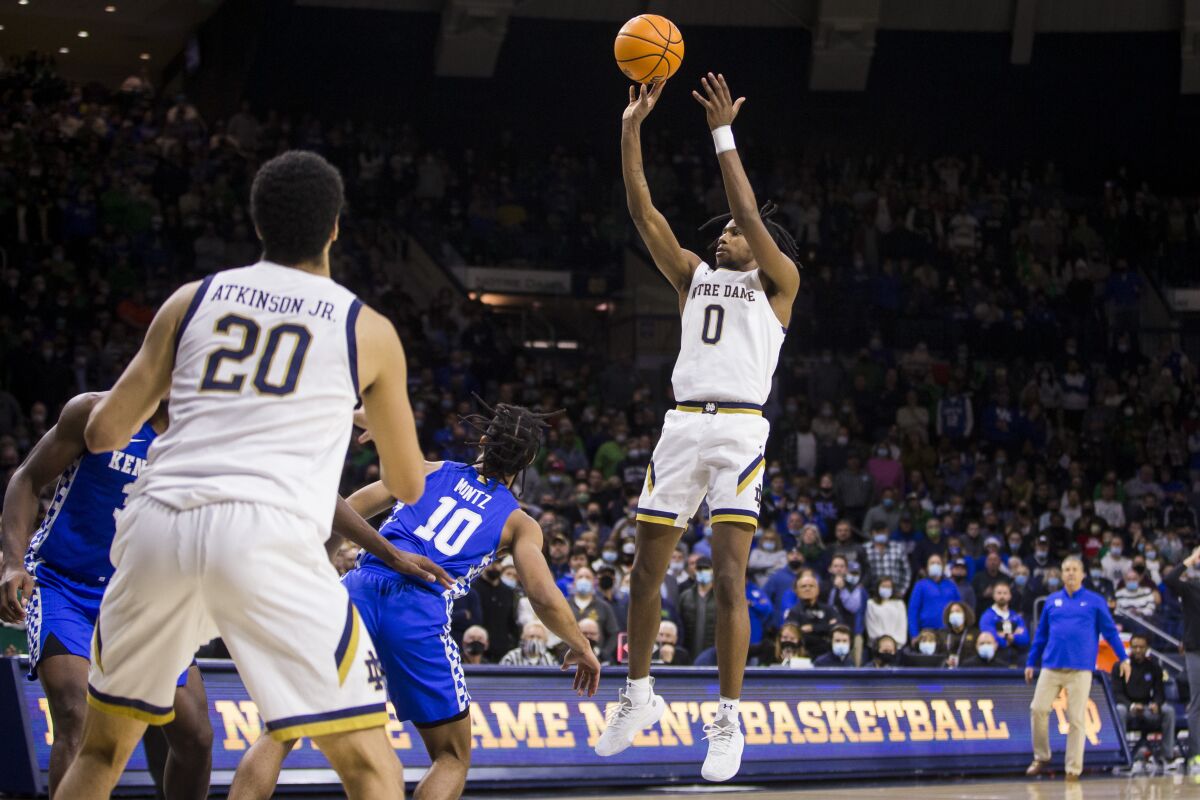 Notre Dame's Blake Wesley (0) shoots the game-winning shot during Notre Dame's win over Kentucky in an NCAA college basketball game Saturday, Dec. 11, 2021, in South Bend, Ind. (AP Photo/Robert Franklin)