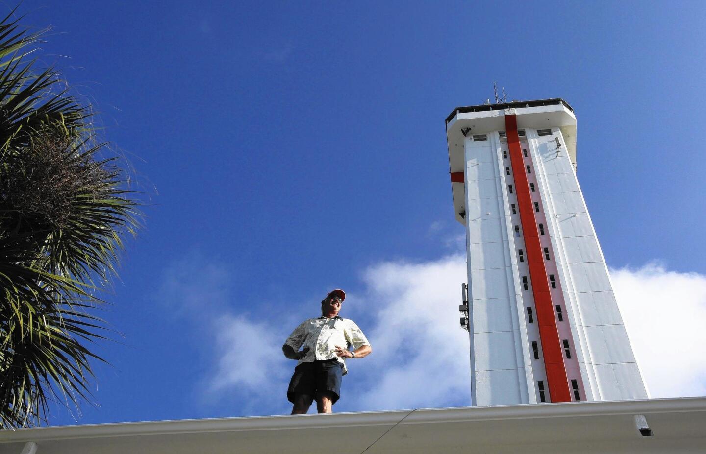 The Citrus Tower, a Clermont landmark built in 1955, is getting fresh paint for the first time in 20 years. Greg Homan, owner since 1995, is pictured by the tower on Tuesday, April 14, 2015. Tom Benitez/Orlando Sentinel