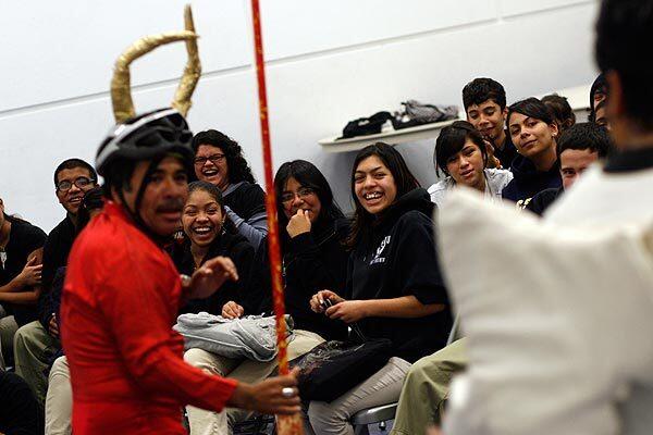 Juan C. Romero plays the devil during a performance at the Animo Pat Brown Charter High School. A traveling troupe of day laborers was funded by a $100,000 grant provided by the Ford Foundation in late 2008, but the money has dried up.