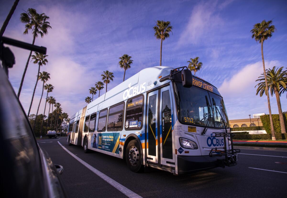 An Orange County Transportation Authority bus on its route in Newport Beach in February 2020.