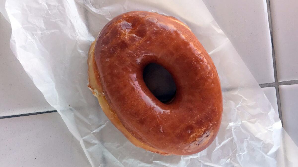 Glazed doughnut from Randy's Donuts. (Jenn Harris / Los Angeles Times)