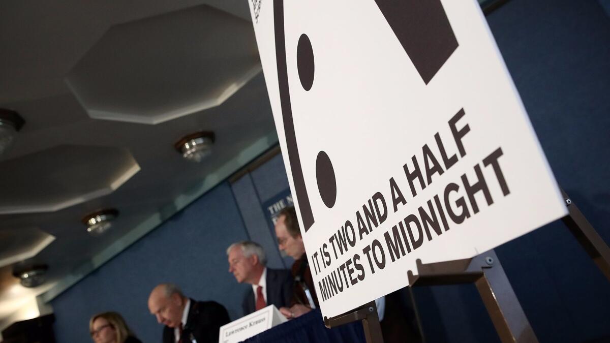 Members of the Bulletin of the Atomic Scientists deliver remarks on the 2017 time for the "Doomsday Clock" on Thursday in Washington, D.C.