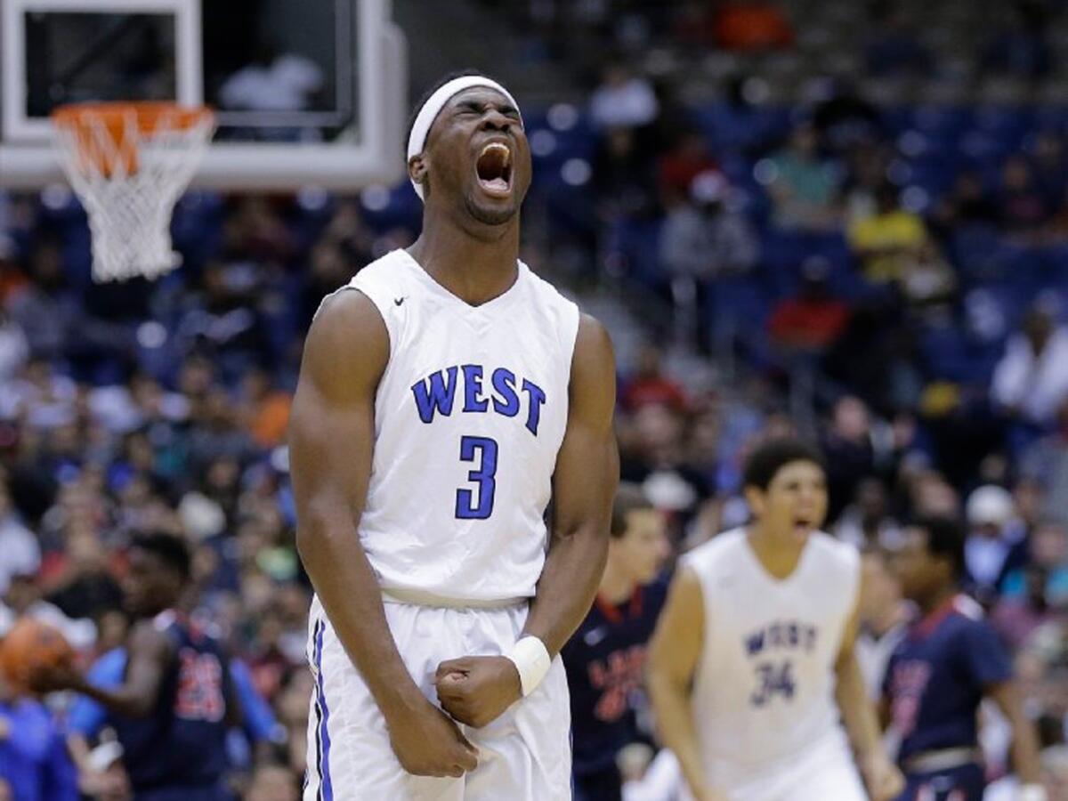 Sotonye Jamabo, who has committed to play football for UCLA, celebrates a basket against Houston Clear Lake during a boys' 6A basketball state finals game in Texas on March 14.