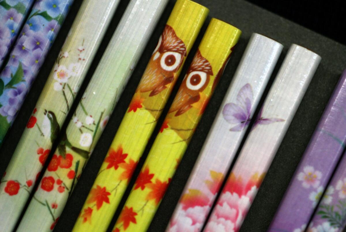Bird, owl and butterfly designs on the handles of chopsticks which can be mixed and matched at Rafu Bussan which has a variety of chopsticks.