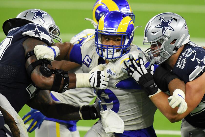 INGLEWOOD, CALIFORNIA - SEPTEMBER 13: Aaron Donald #99 of the Los Angeles Rams rushes against Connor Williams #52 and the Dallas Cowboys offensive line during the second half at SoFi Stadium on September 13, 2020 in Inglewood, California. (Photo by Harry How/Getty Images)