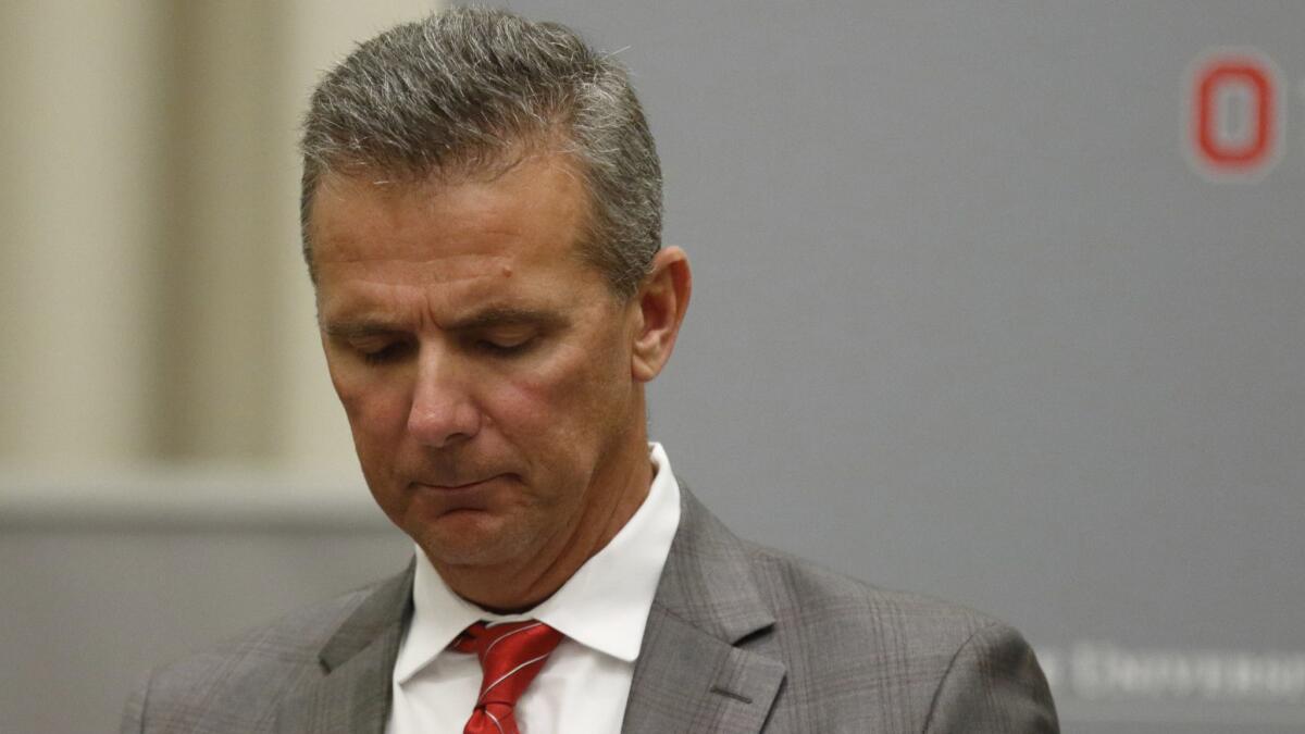 Ohio State football coach Urban Meyer makes a statement during a news conference in Columbus, Ohio, on Aug. 22 to announce the results of an investigation for the way he handled domestic-abuse allegations against a former assistant.