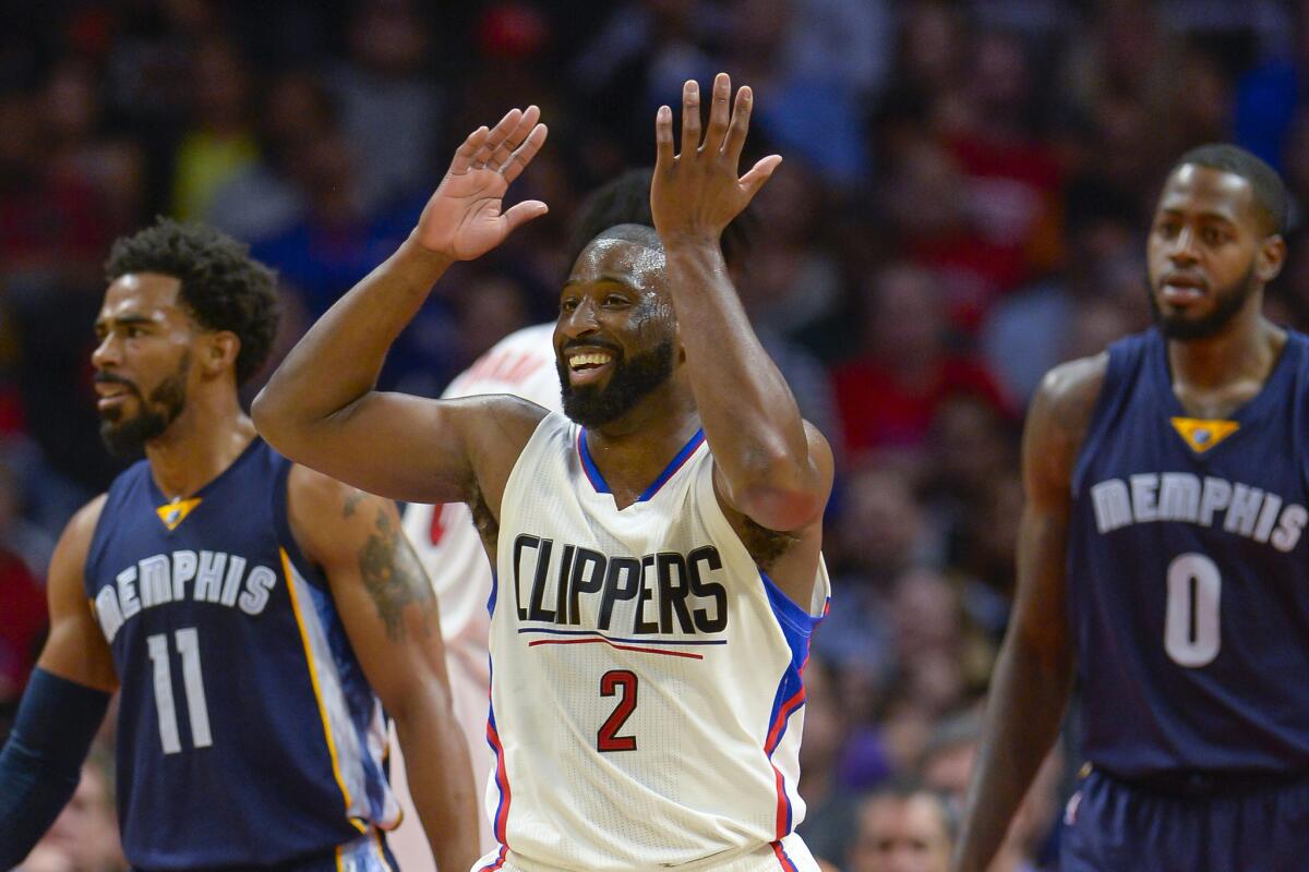 Clippers guard Raymond Felton reacts to a referee's call during a game against the Grizzlies as Memphis'Mike Conley, left, and JaMychal Green look on.