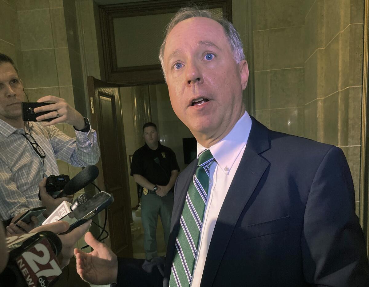 FILE - Wisconsin Assembly Speaker Robin Vos talks to reporters March 16, 2022, in Madison, Wis. Vos defeated a little-known Donald Trump-endorsed challenger in the Republican primary Tuesday, Aug. 8, overcoming intense criticism from Trump and others that he hadn't pursued decertifying the 2020 election won by President Joe Biden. (AP Photo Scott Bauer, File)