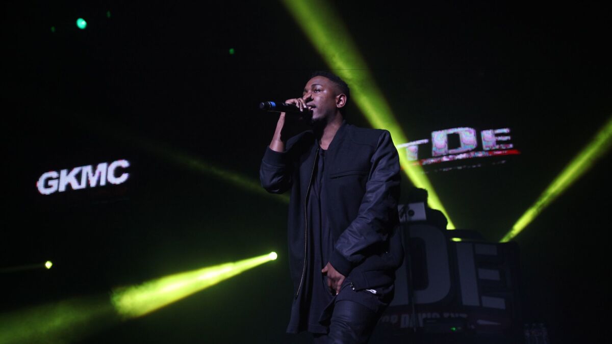 Artist Kendrick Lamar performs at a 2012 Cali Christmas concert in Los Angeles sponsored by hip-hop radio station Power 106.