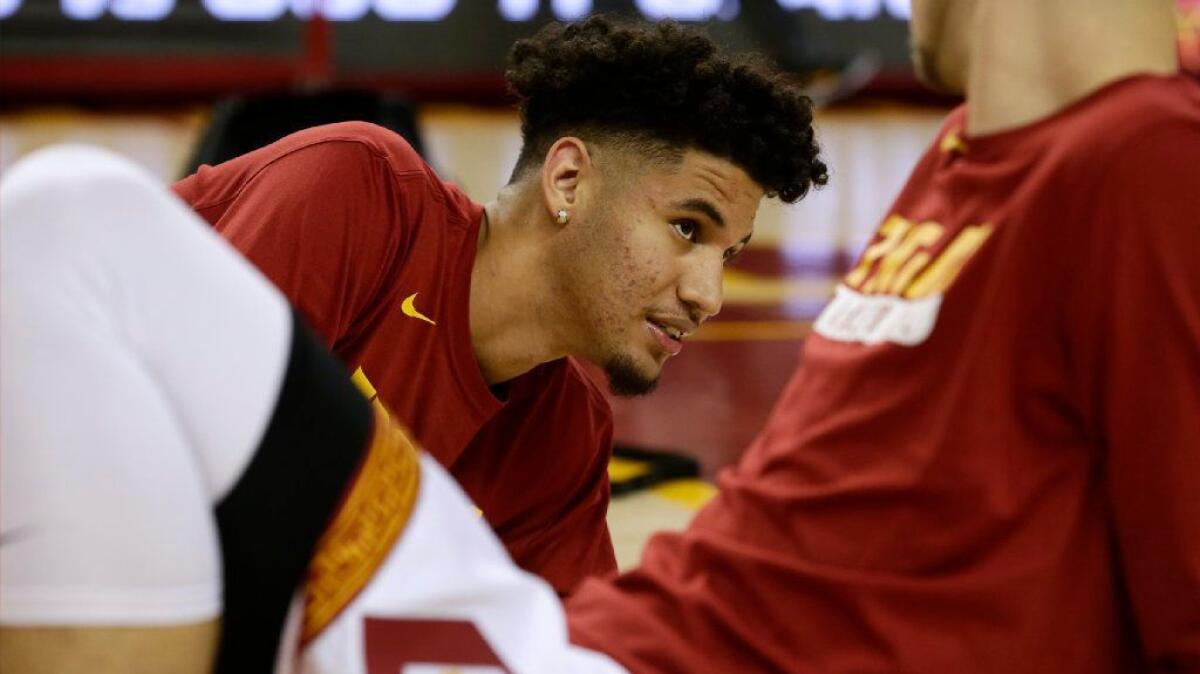 USC forward Bennie Boatwright stretches with his teammates before a game against UCLA at the Galen Center on Jan. 25.