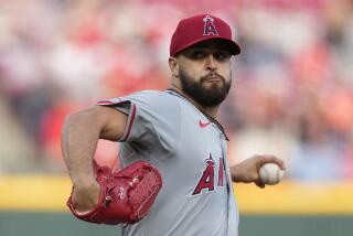 Los Angeles Angels starting pitcher Patrick Sandoval throws in the first inning of a baseball game.