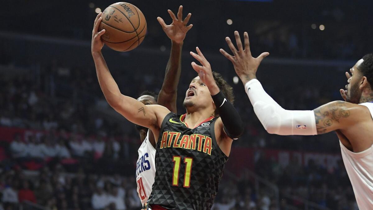 Atlanta guard Trae Young drives to the basket against Clippers, who guard Avery Bradley says took a step back defensively in a 123-118 loss to the Hawks on Monday.