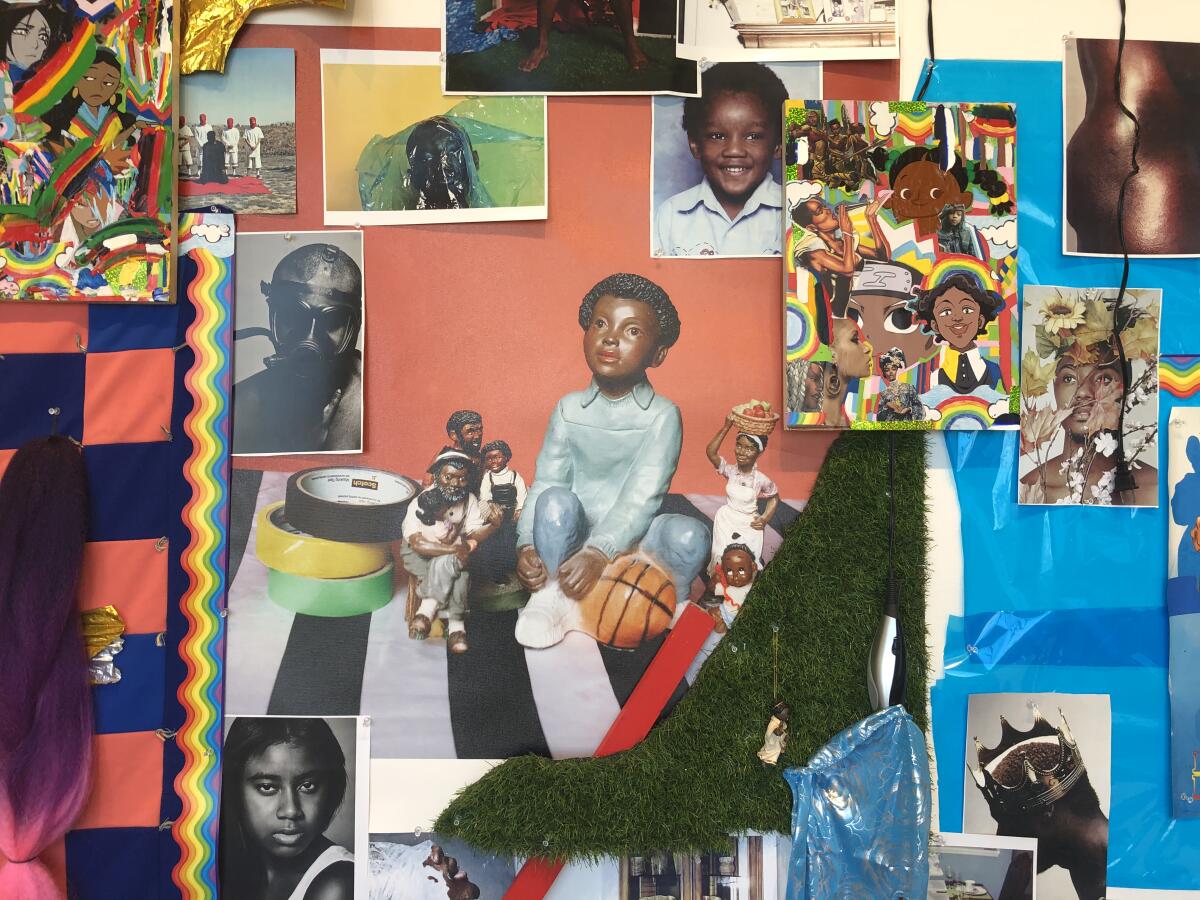 A close up a shrine shows family pictures presented alongside images from magazines of Black people.