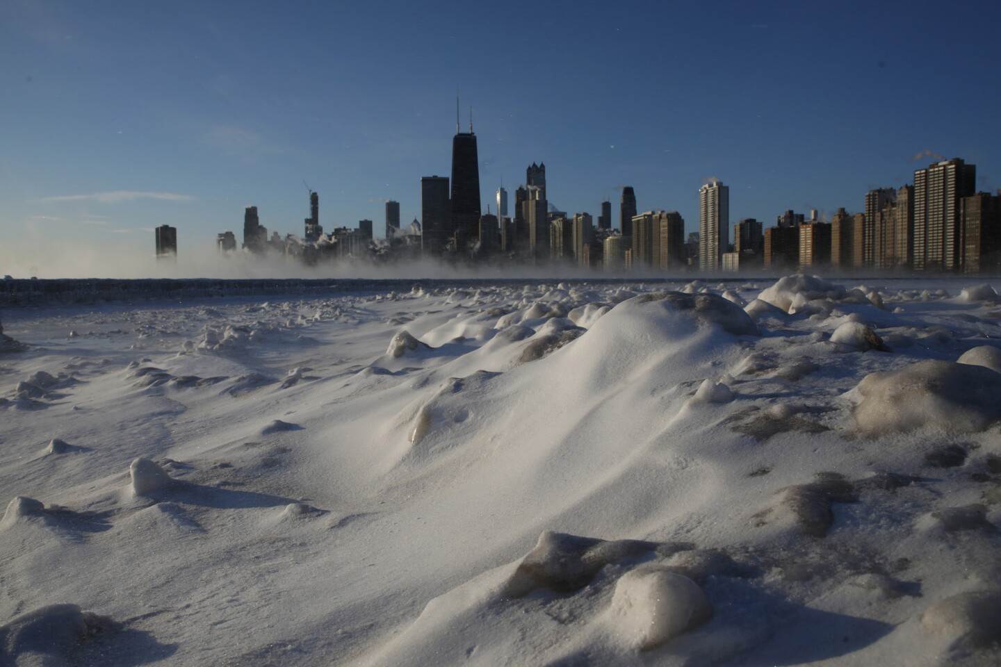 The sunrise reveals a frigid Chicago lakefront with temperatures around minus 20 degrees early Jan. 30, 2019.