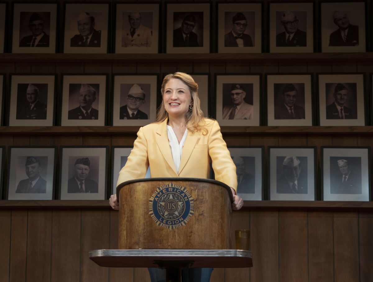 This image released by Amazon Studios shows Heidi Schreck in a scene from "What the Conststution Means to Me," which draws on Schreck’s experiences as a high-school debate champ and the lives of her female relatives to explore America’s principles and the struggle women and minorities have faced to be heard and protected by its founding document. In the work, Schreck calls the Constitution “a living, warm-blooded, steamy document,” but one in which women’s bodies were left out “from the beginning.” It streams on Amazon on Friday. (Joan Marcus/Amazon via AP)