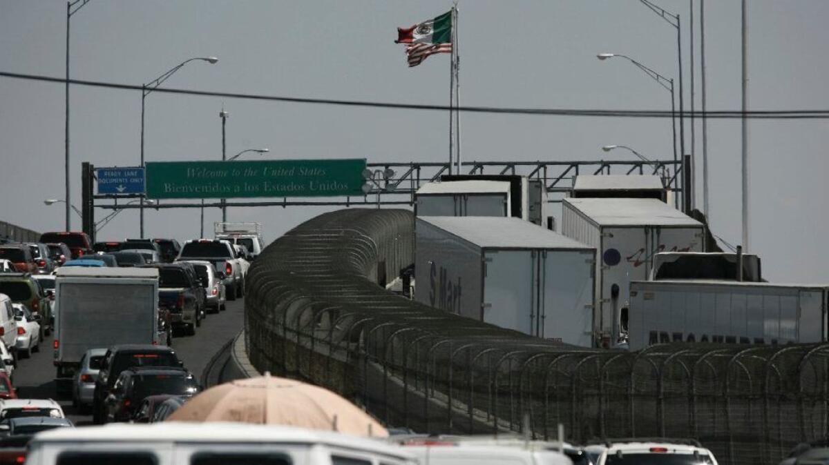 Trucks carrying cargo into the United States line up at the border in Ciudad Juarez, Mexico, on May 31.