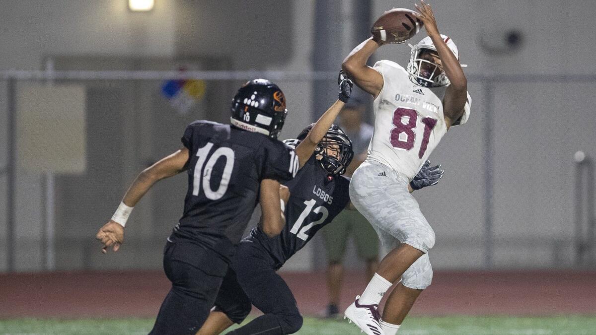 Ocean View High's Naeco Logan, pictured catching a touchdown pass against Los Amigos on Aug. 23, helped the Seahawks defeat rival Westminster 42-7 on Friday.