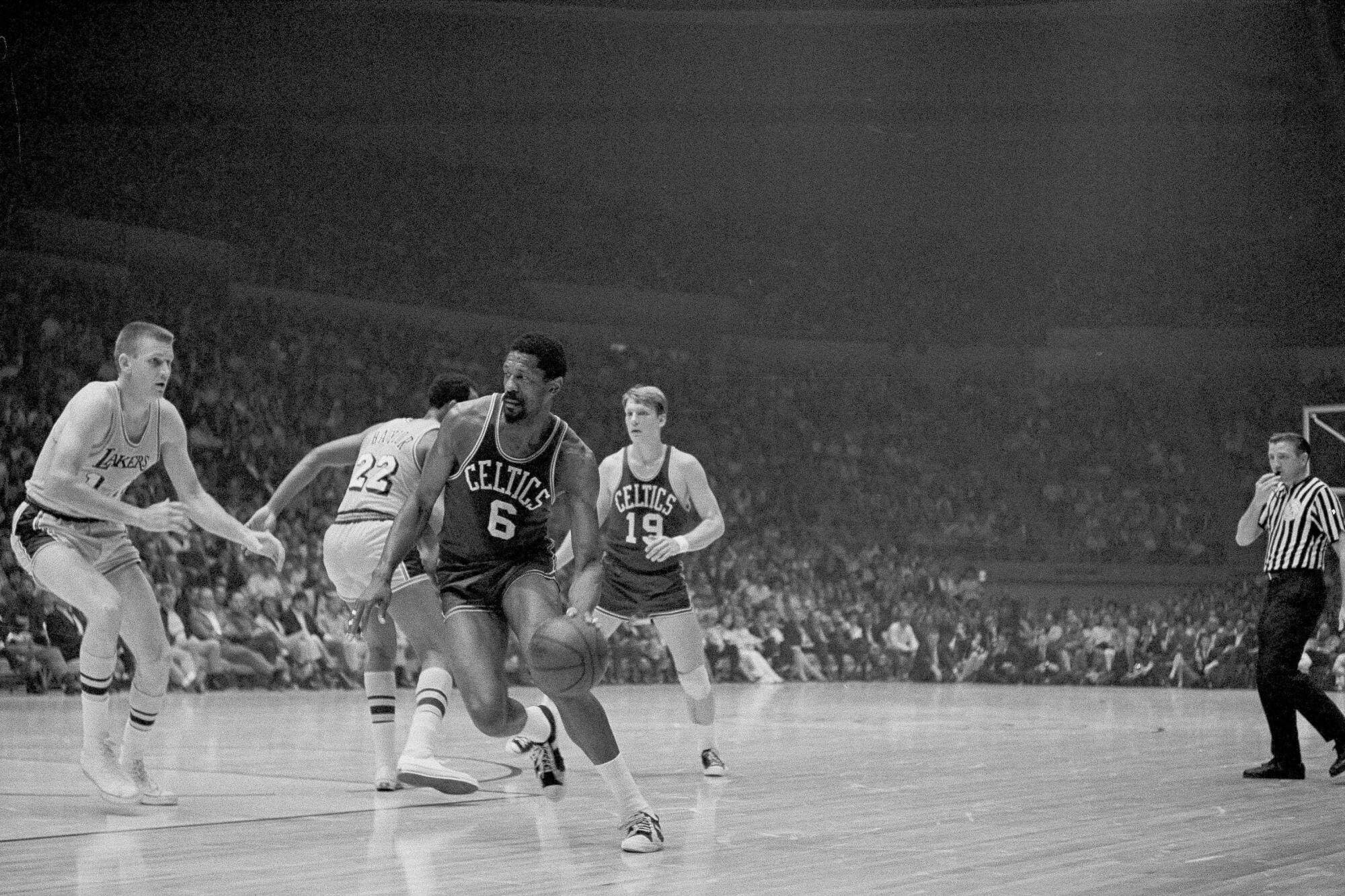 Bill Russell drives against the Lakers in a 1969 game.